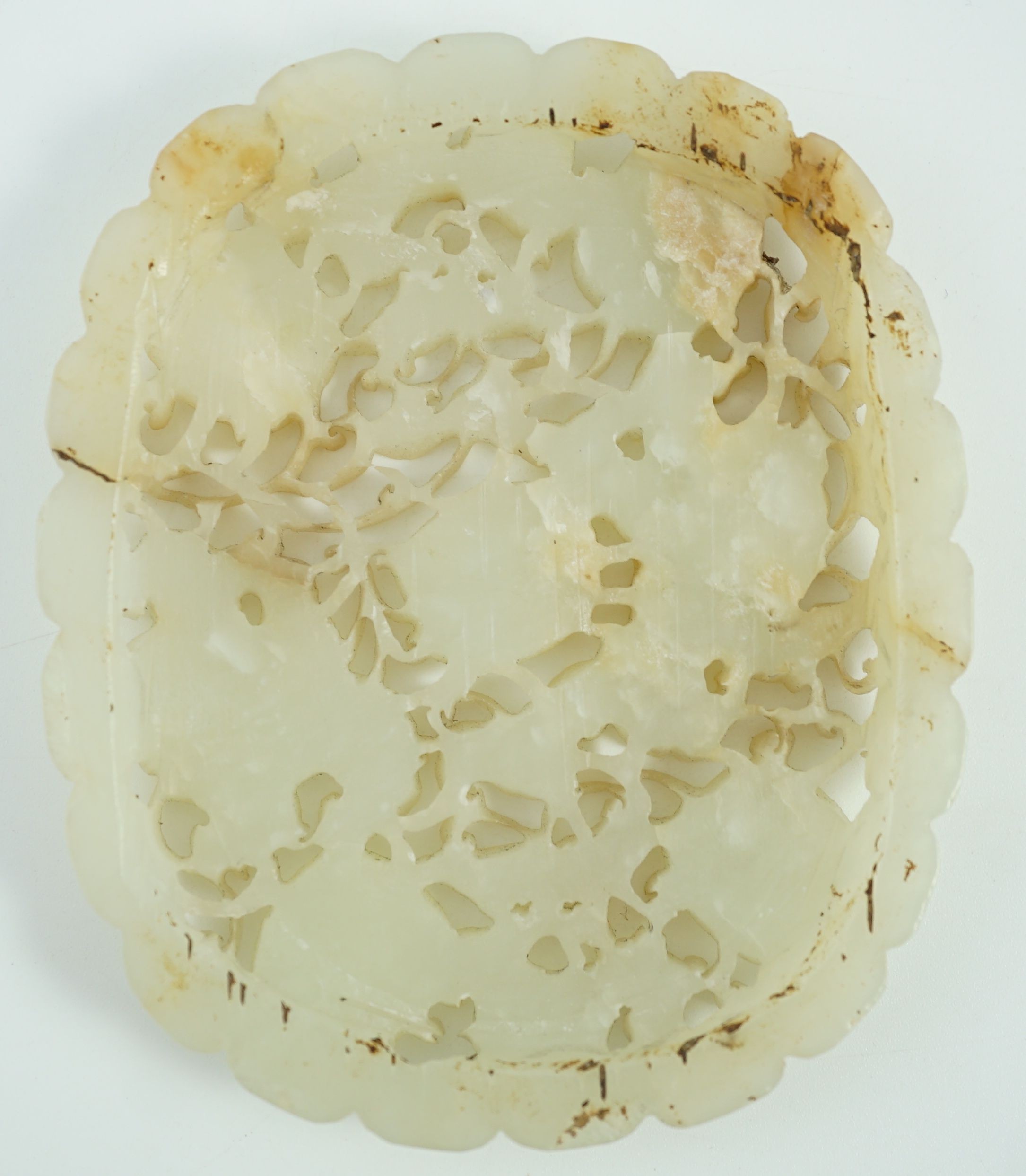 A Chinese pale celadon jade oval openwork plaque, 19th century, 9.8 cm x 8.2 cm